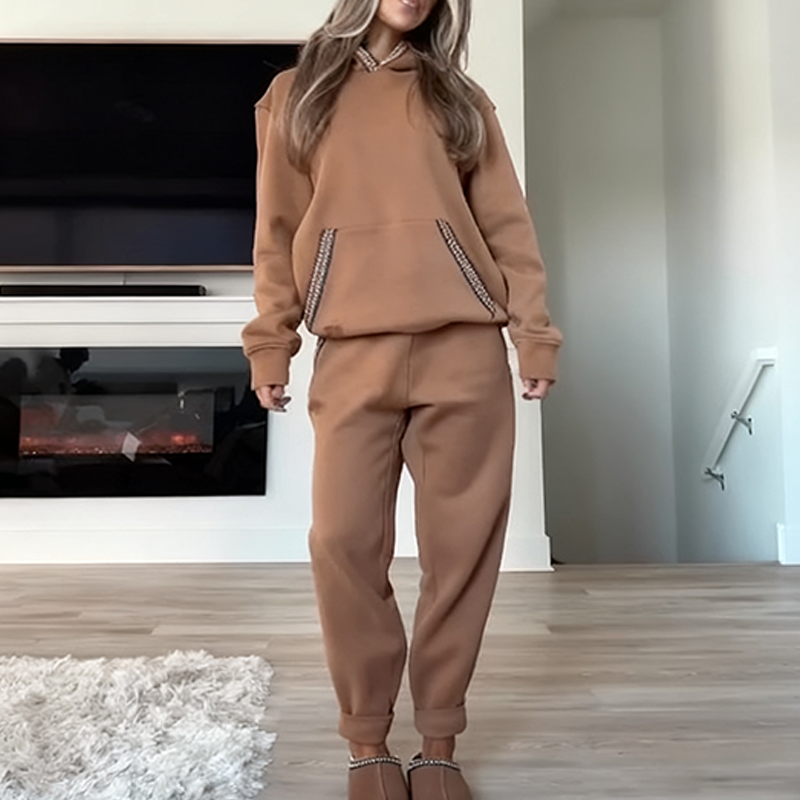 Women's casual outfit with hooded top and elastic waist pants