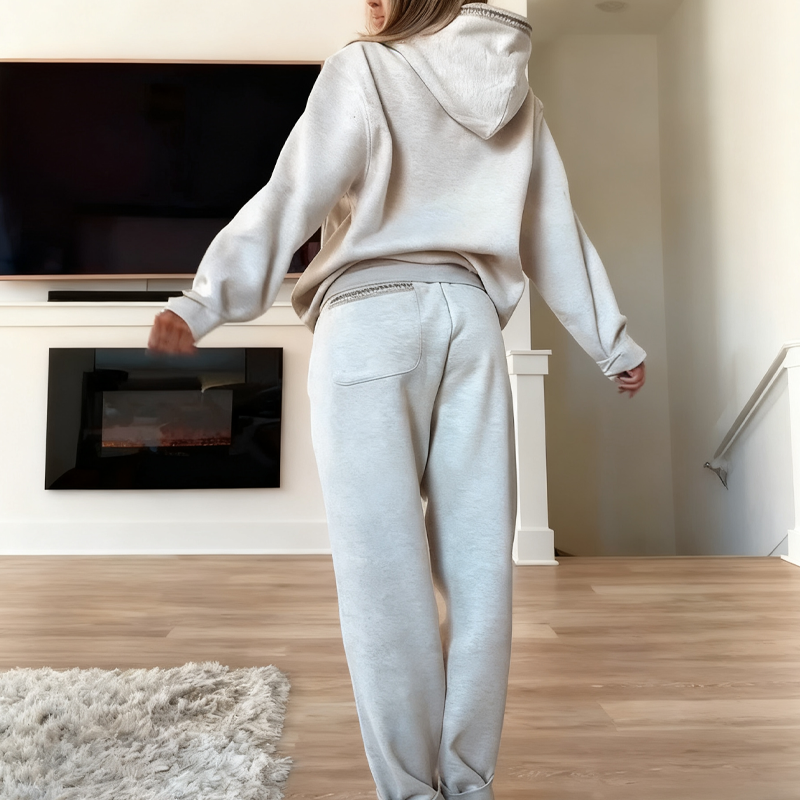 Women's casual outfit with hooded top and elastic waist pants