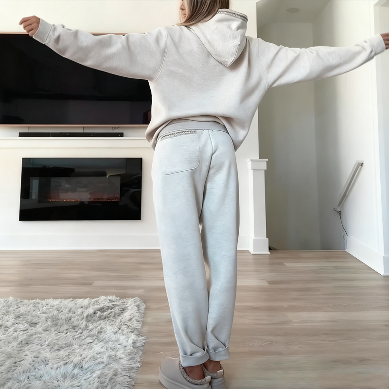 Women's casual outfit with hooded top and elastic waist pants